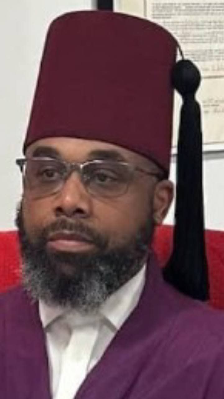 Convention Chairman Charles Brown-EL wearing a fez